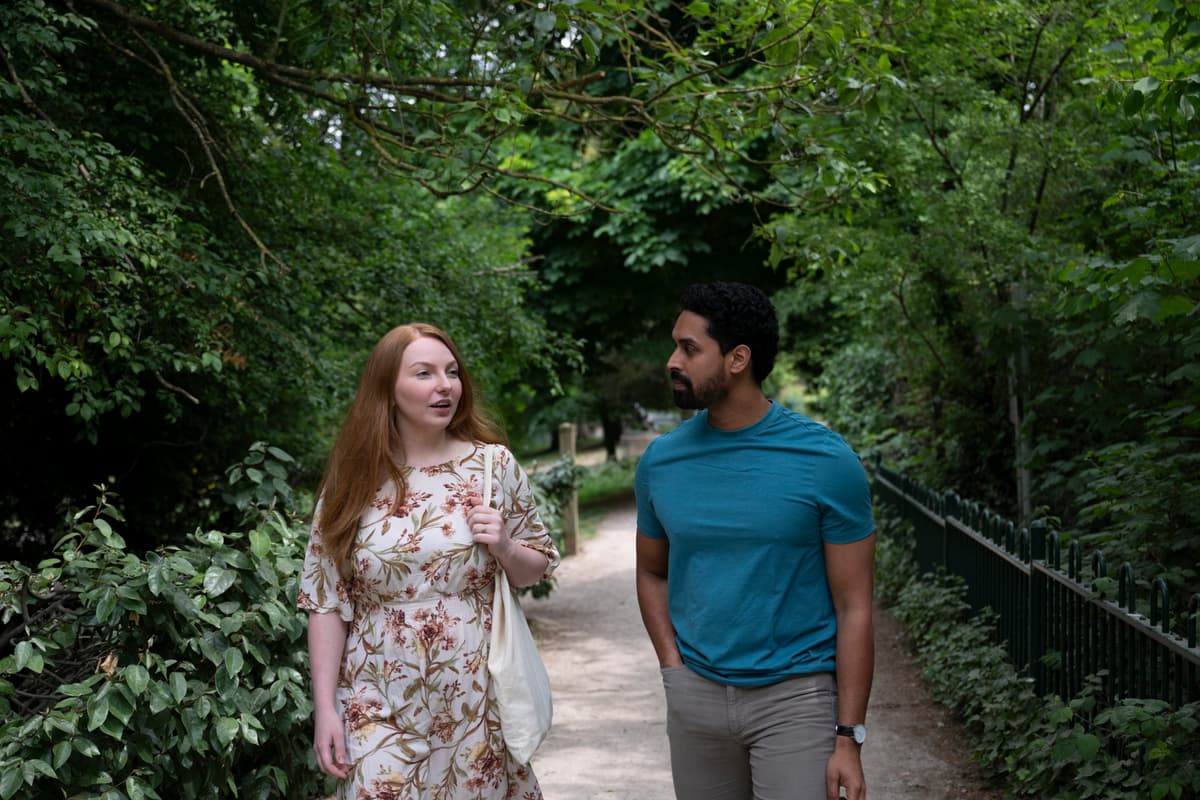 Man and woman walking in nature.