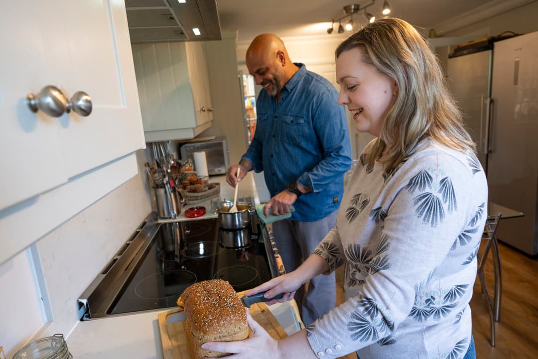 Man and woman preparing a meal.