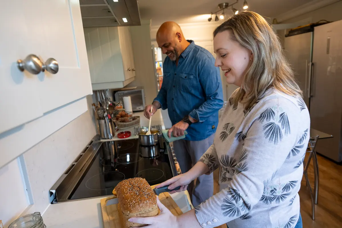 Man and woman preparing a meal.