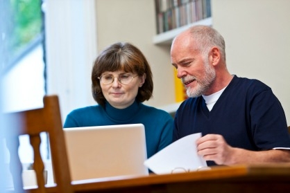 A couple at home browsing the website