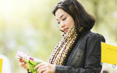Woman ponders vegetables in the food market