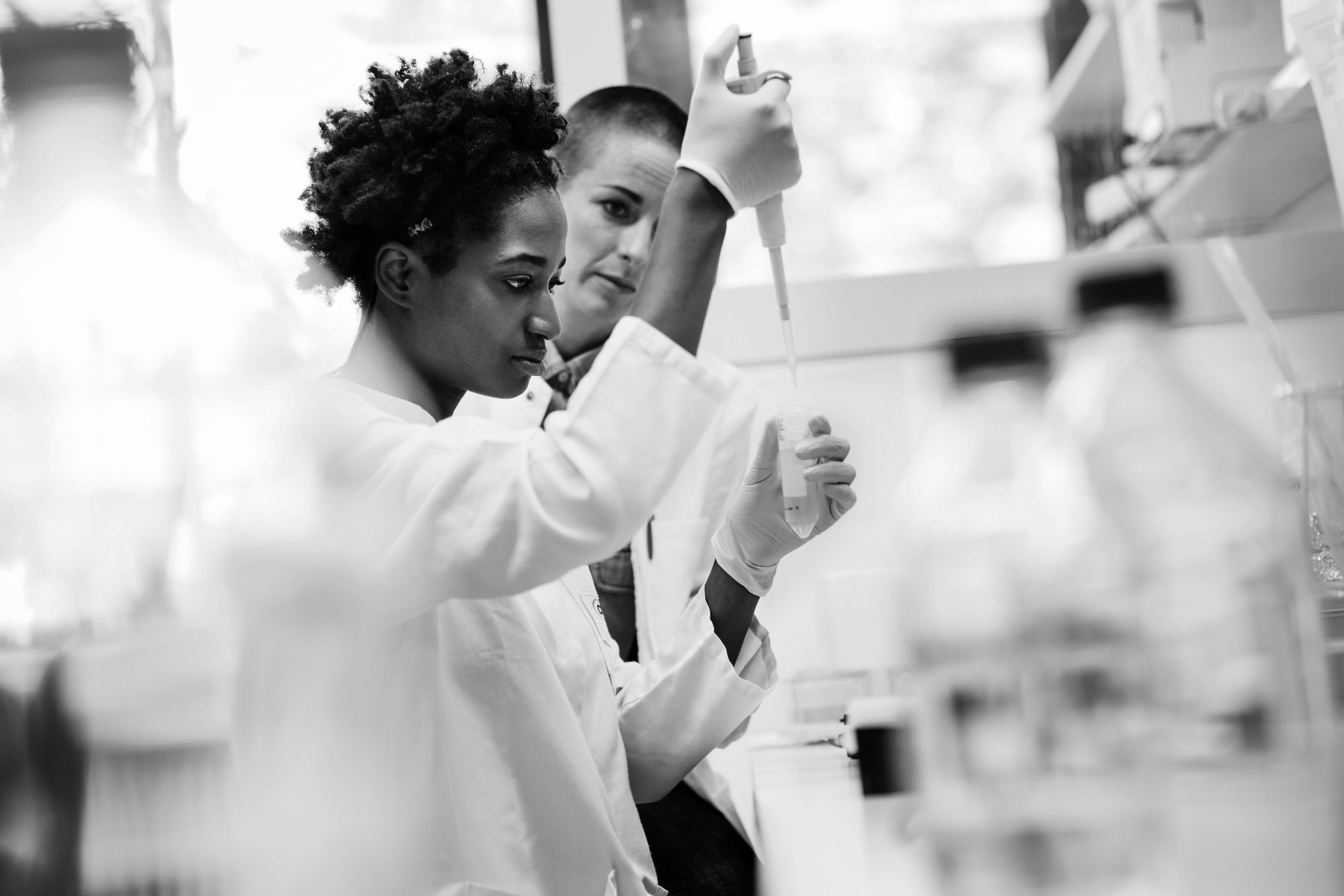 Two female scientists working together in a research laboratory.