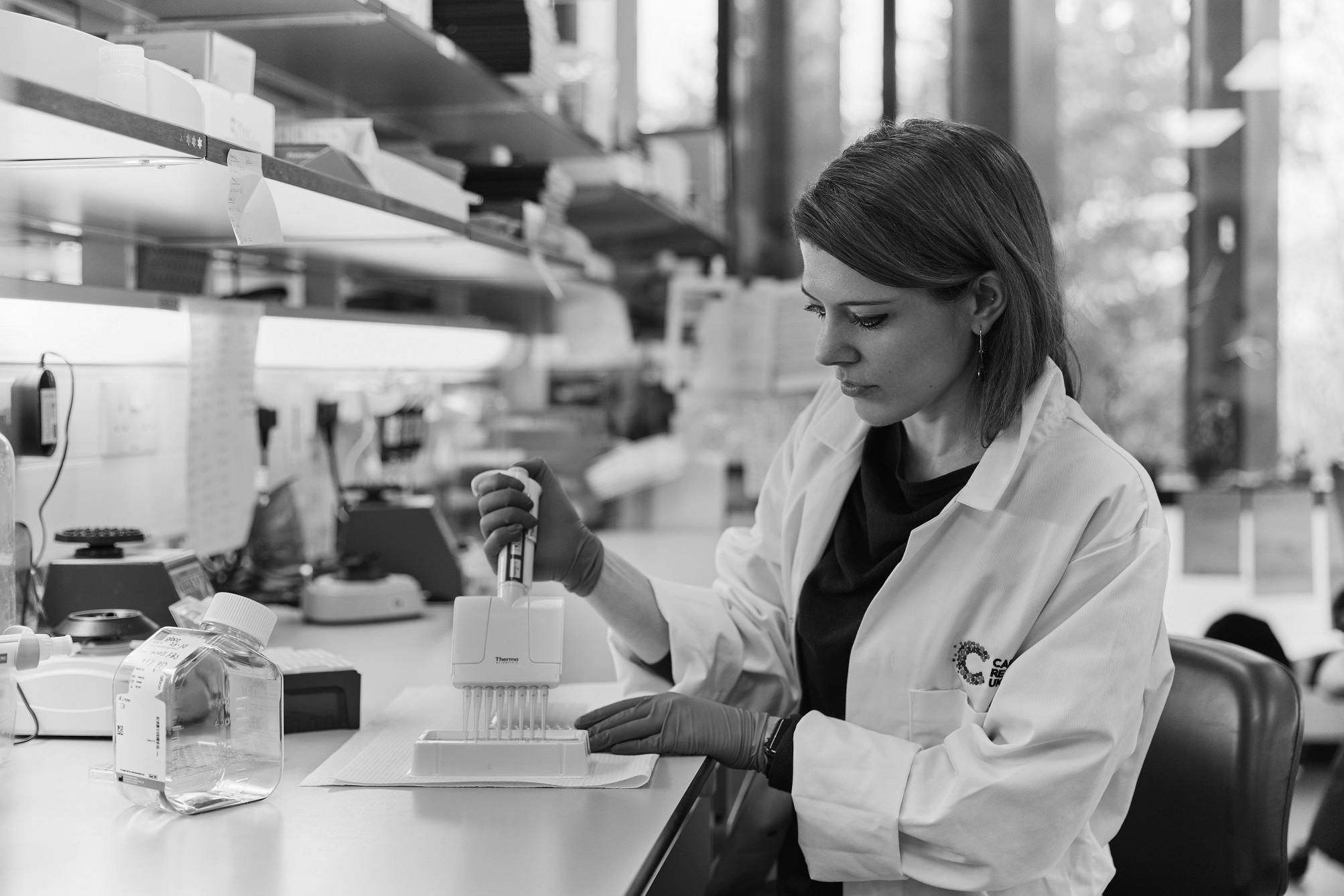 A Cancer Research UK researcher working in a lab.