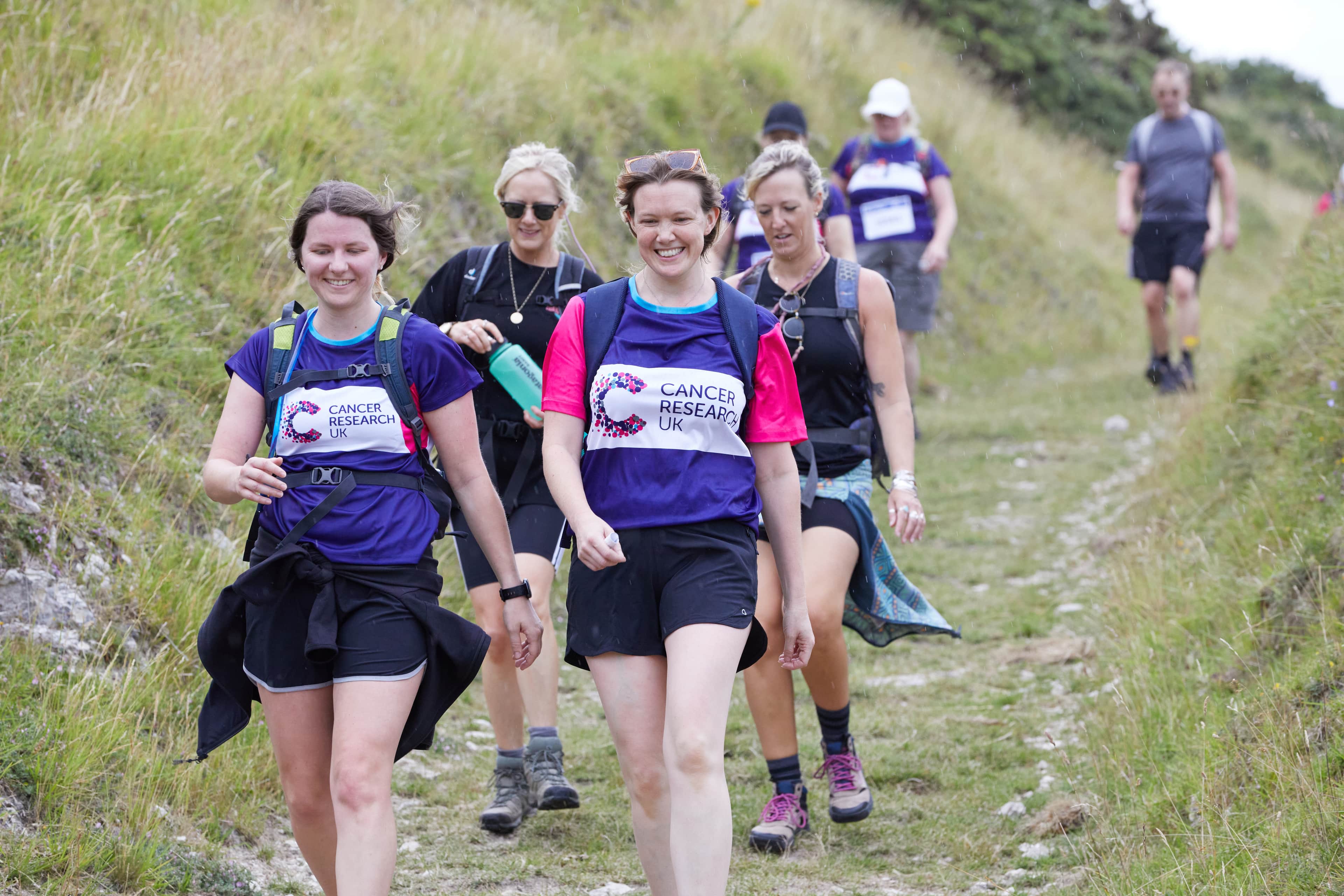 Big Hike participants walking down a hill.