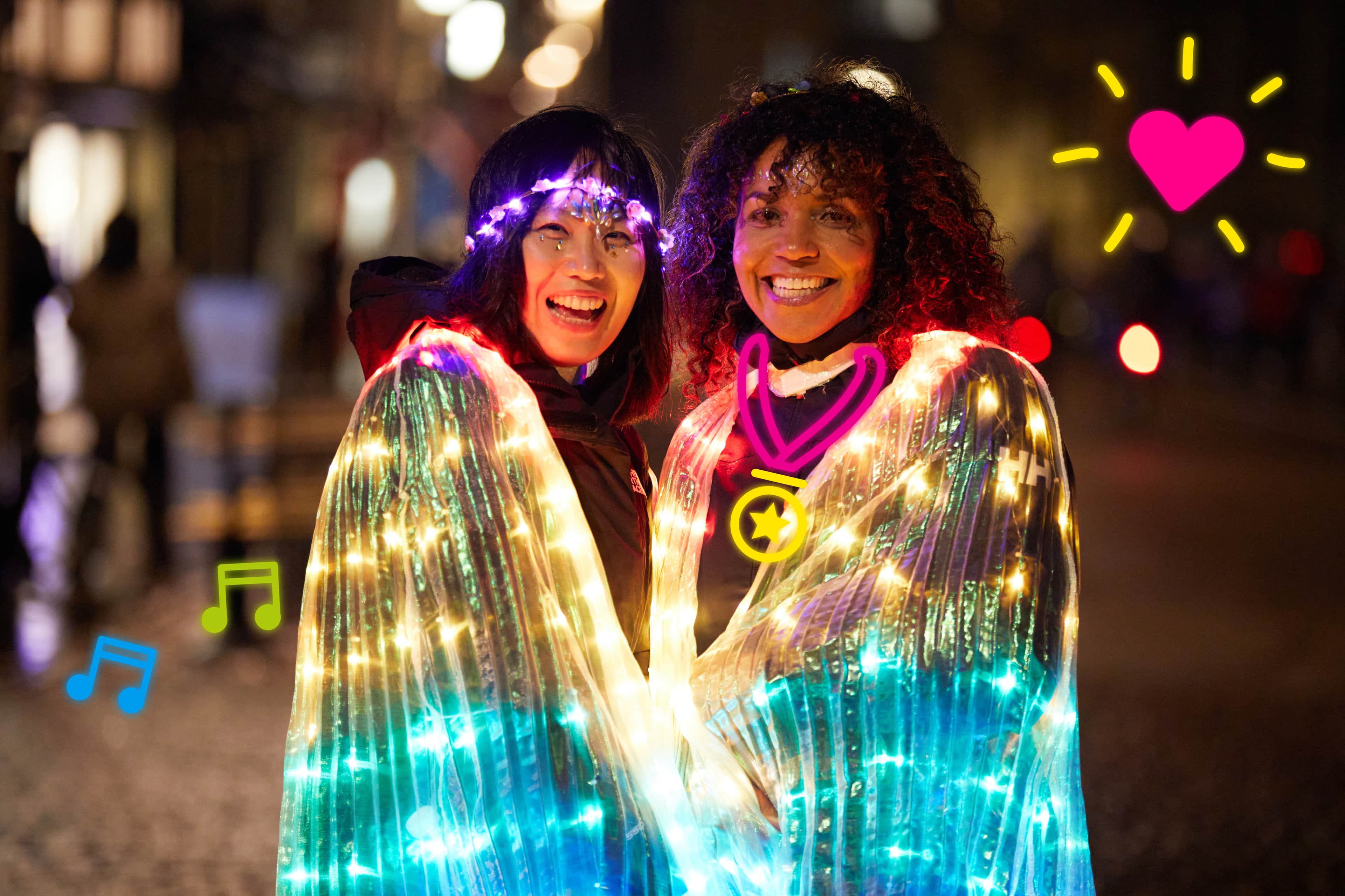 Shine Night participants glowing with lights, surrounded by colourful doodles.