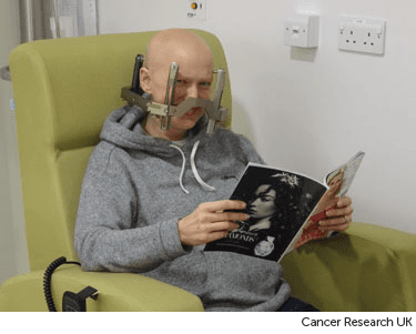 Having radiosurgery treatment.