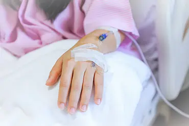 Photograph of child’s cannula in the hand.