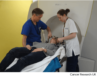 Photograph showing woman having radiosurgery treatment.