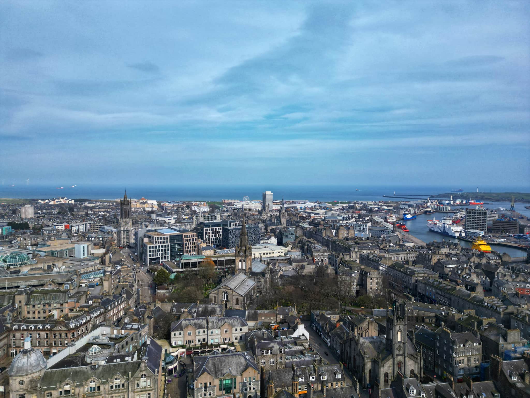 The city of Aberdeen, Scotland from the sky showing Aberdeen beach and the port of Aberdeen in the horizon.