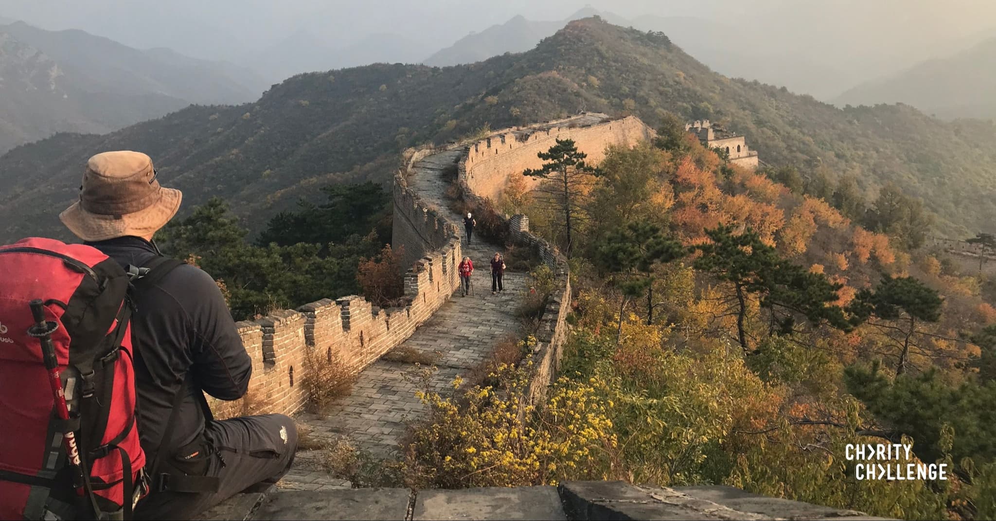 An image of a hiker on the Great Wall of China.