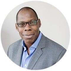 Headshot of CRUK Trustee John Armah.
