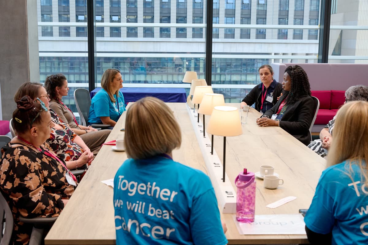 A photo of two Cancer Insights Panel members having a conversation.