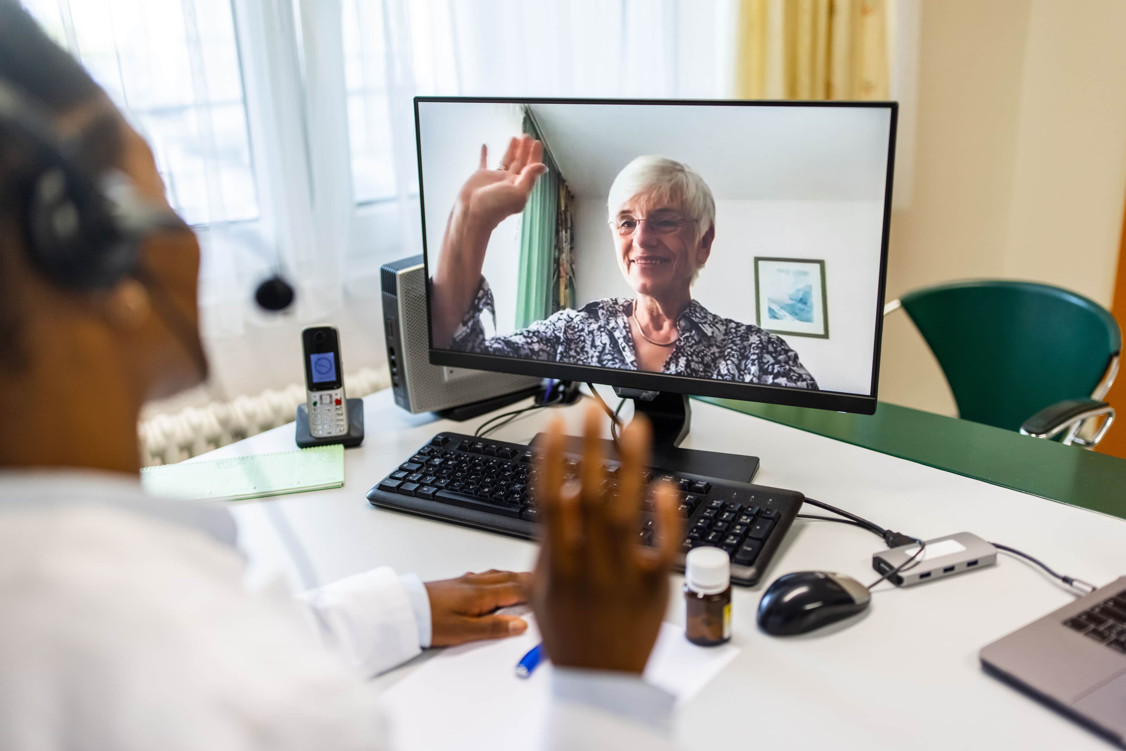 Photo of Doctor and patient on video call.