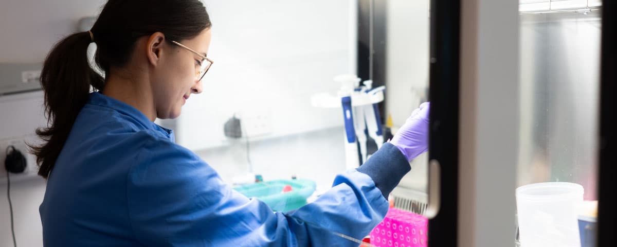 A CRUK scientist working in the lab.