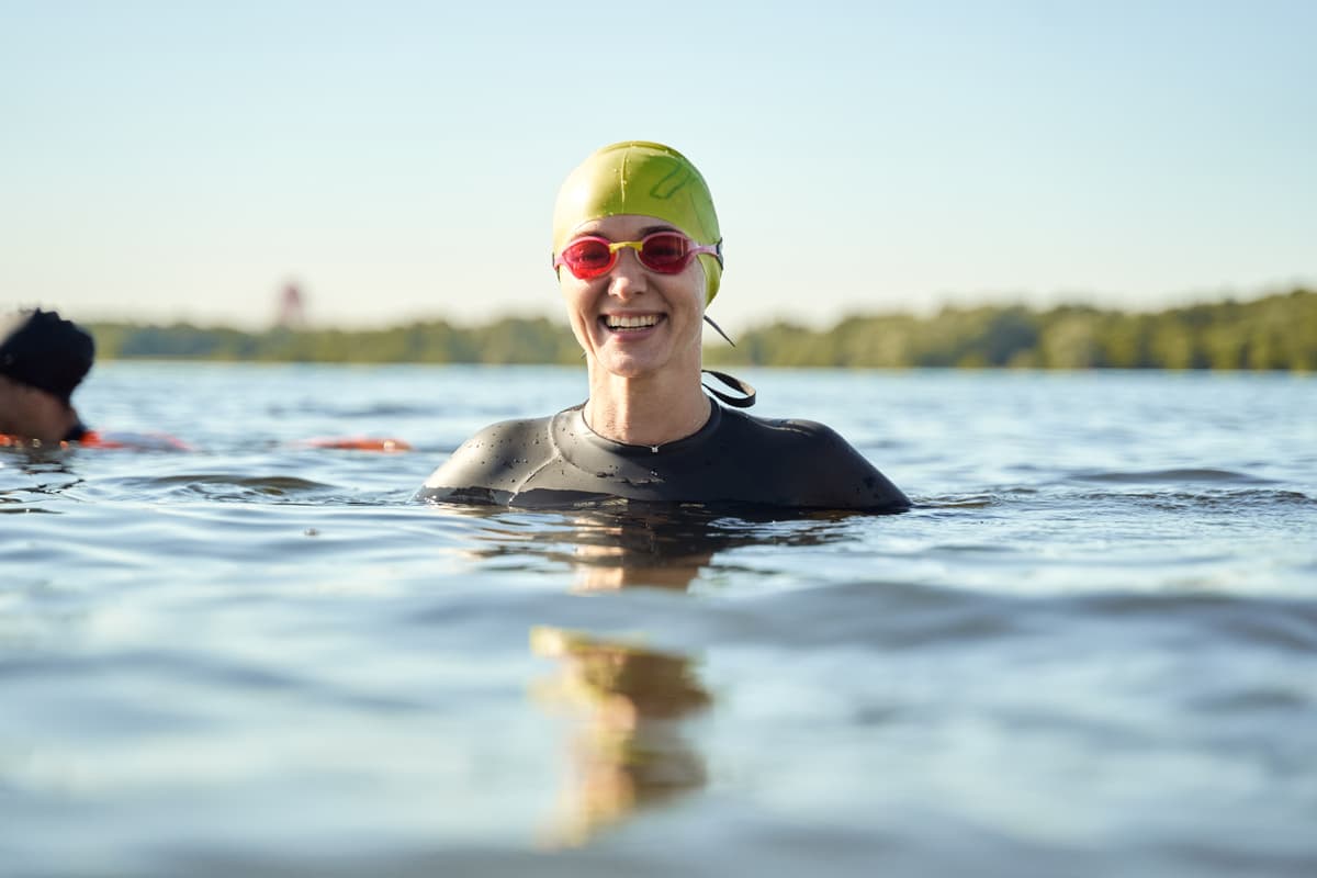 A photo of a swimmer smiling.