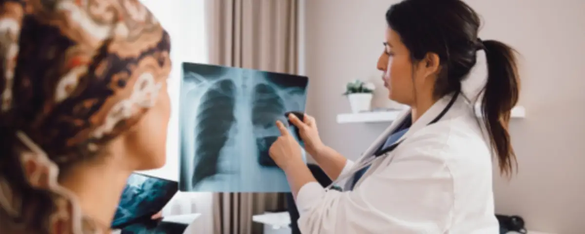 Dr and patient looking at a lung x-ray.