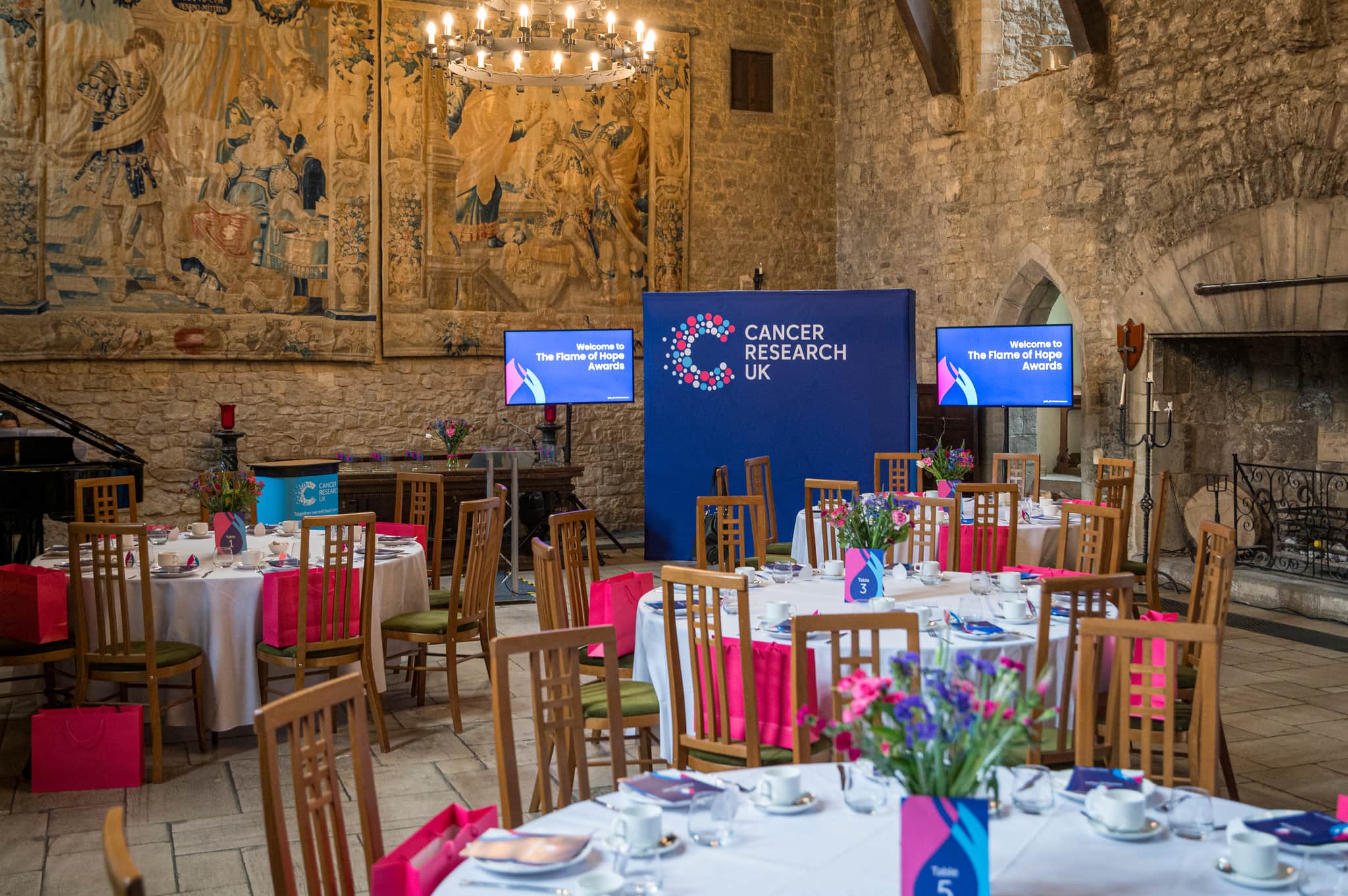 Photograph of tables and chairs at Flame of Hope awards 2024.