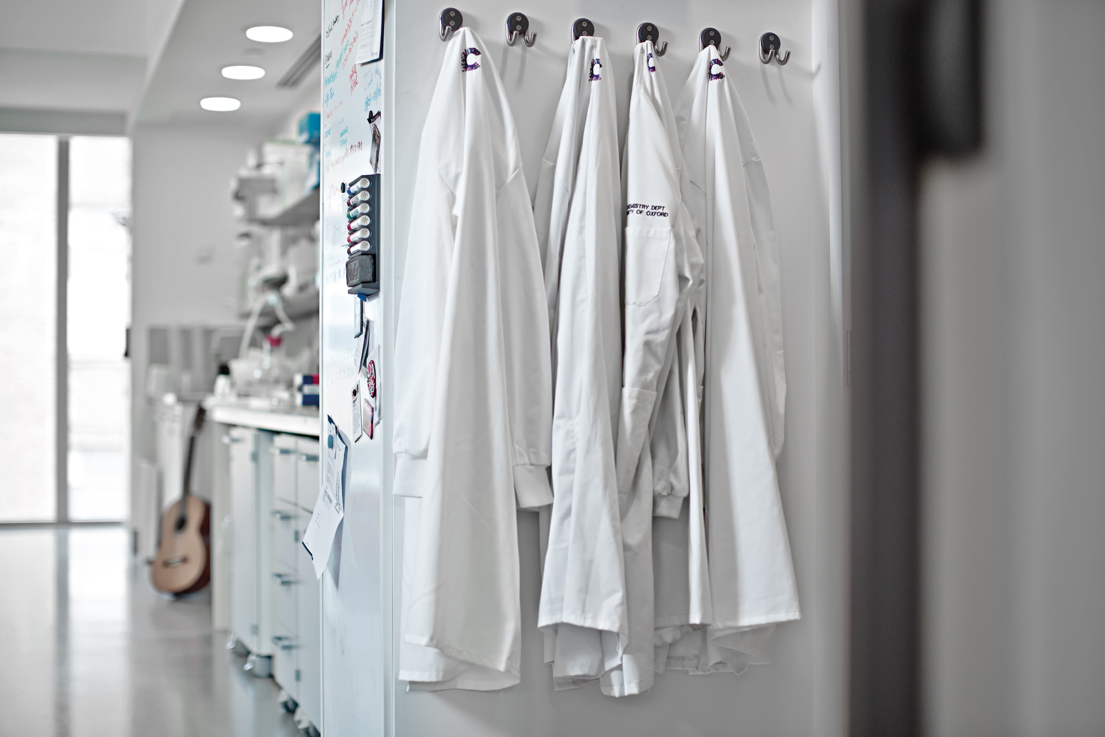 Laboratory coats hanging in the laboratory at Oxford Institute.