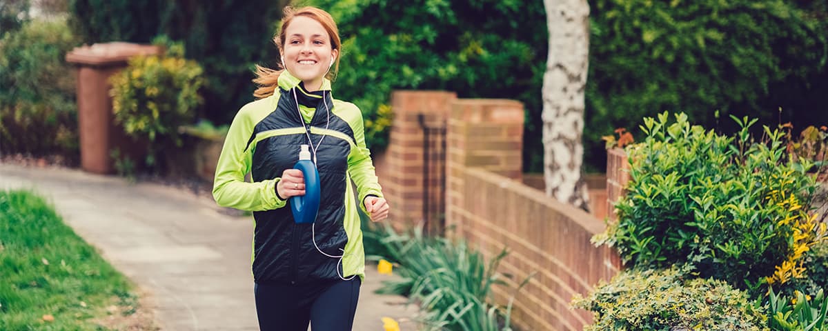 Woman running along a path.