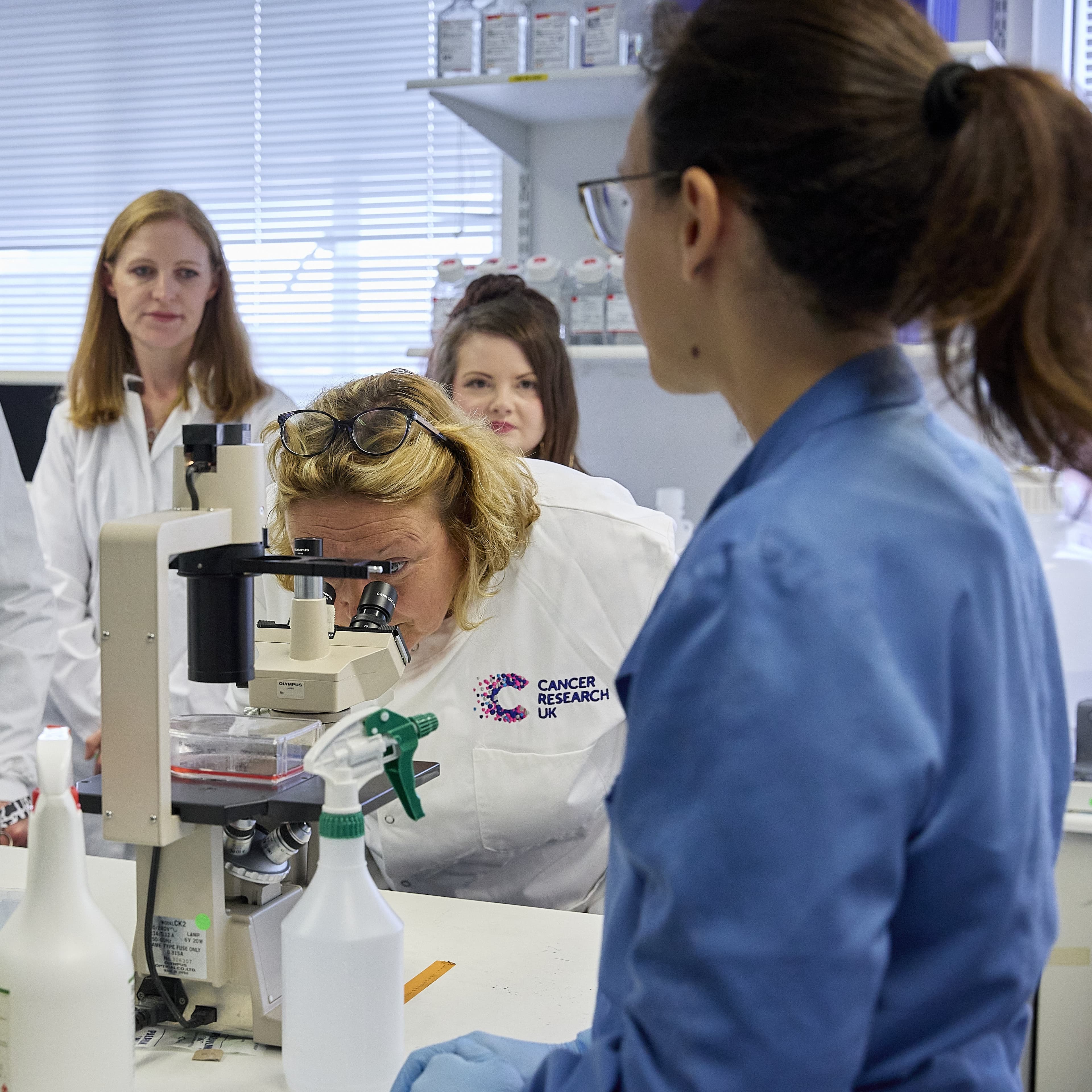 A group of people having a lab tour.