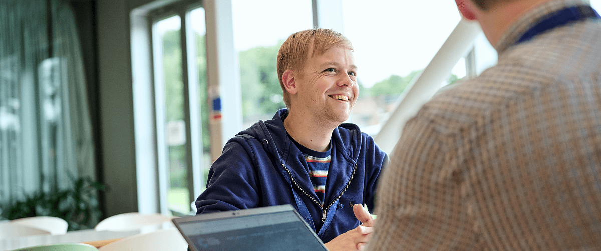 Researcher smiling.