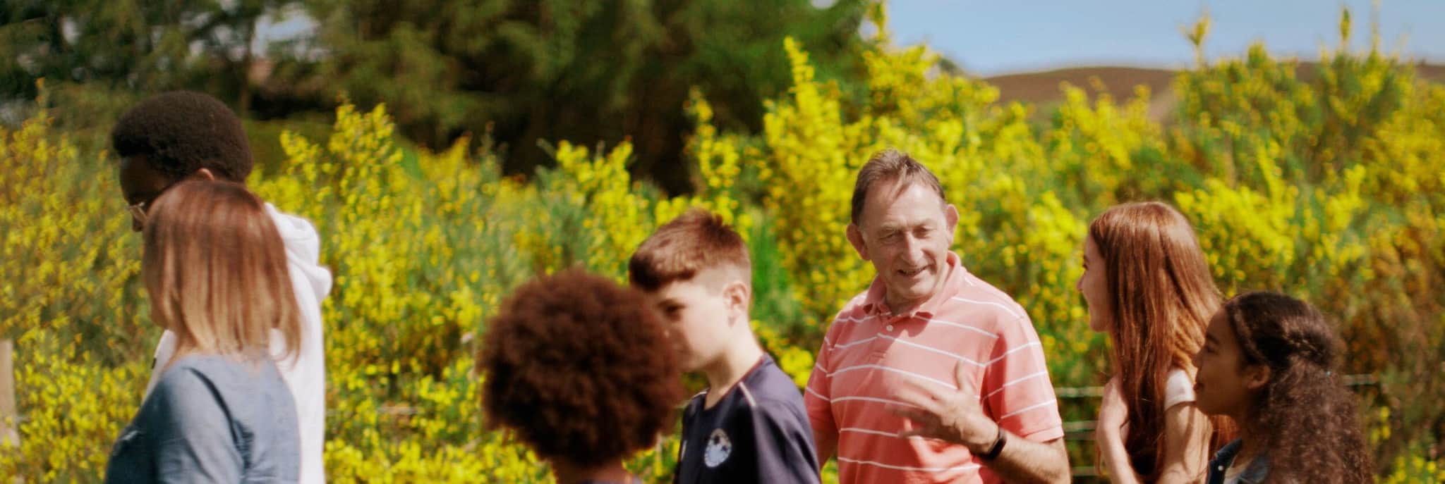 Pledger Jo, walking with his family.