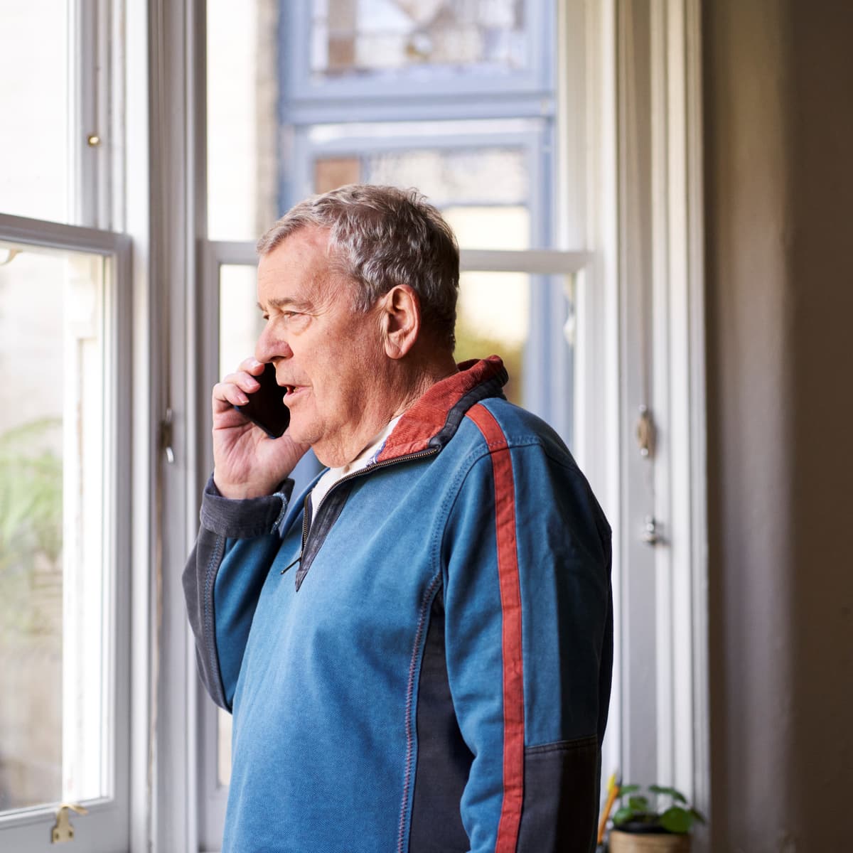 Image of a man on the phone.