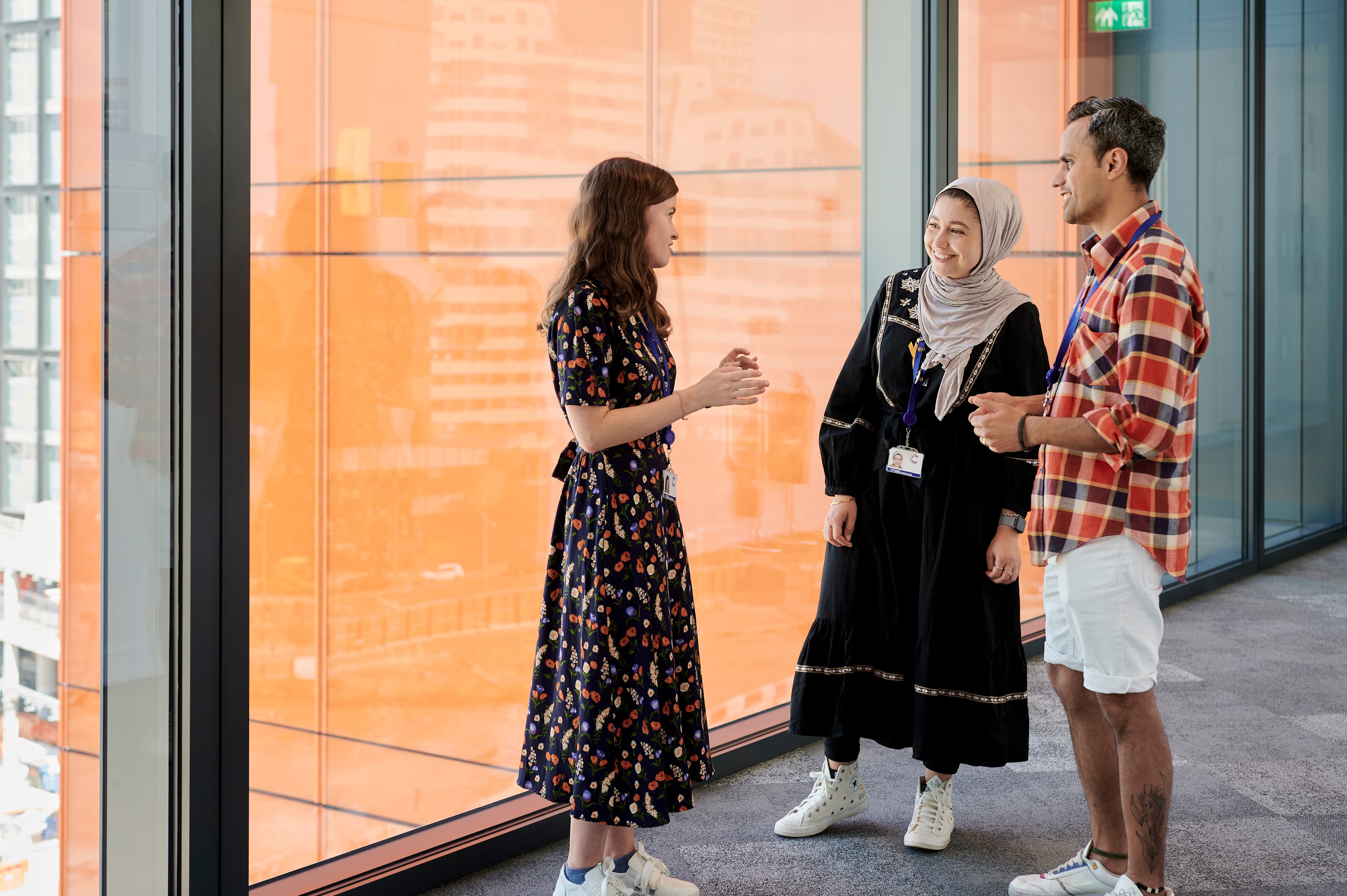 Image of three Cancer Research UK staff who work in the Stratford headquarters.