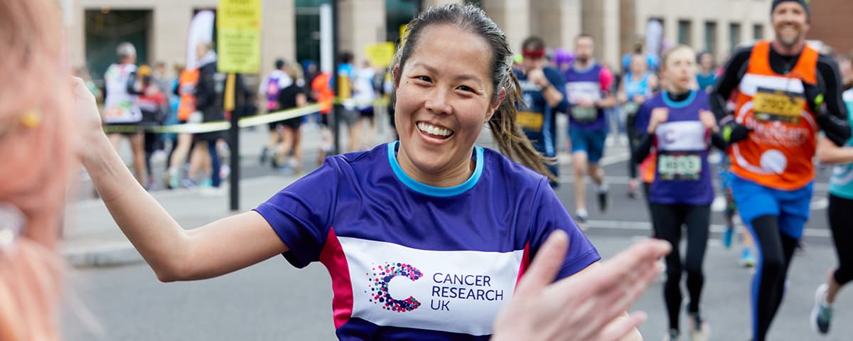 Marathon runner completing race.