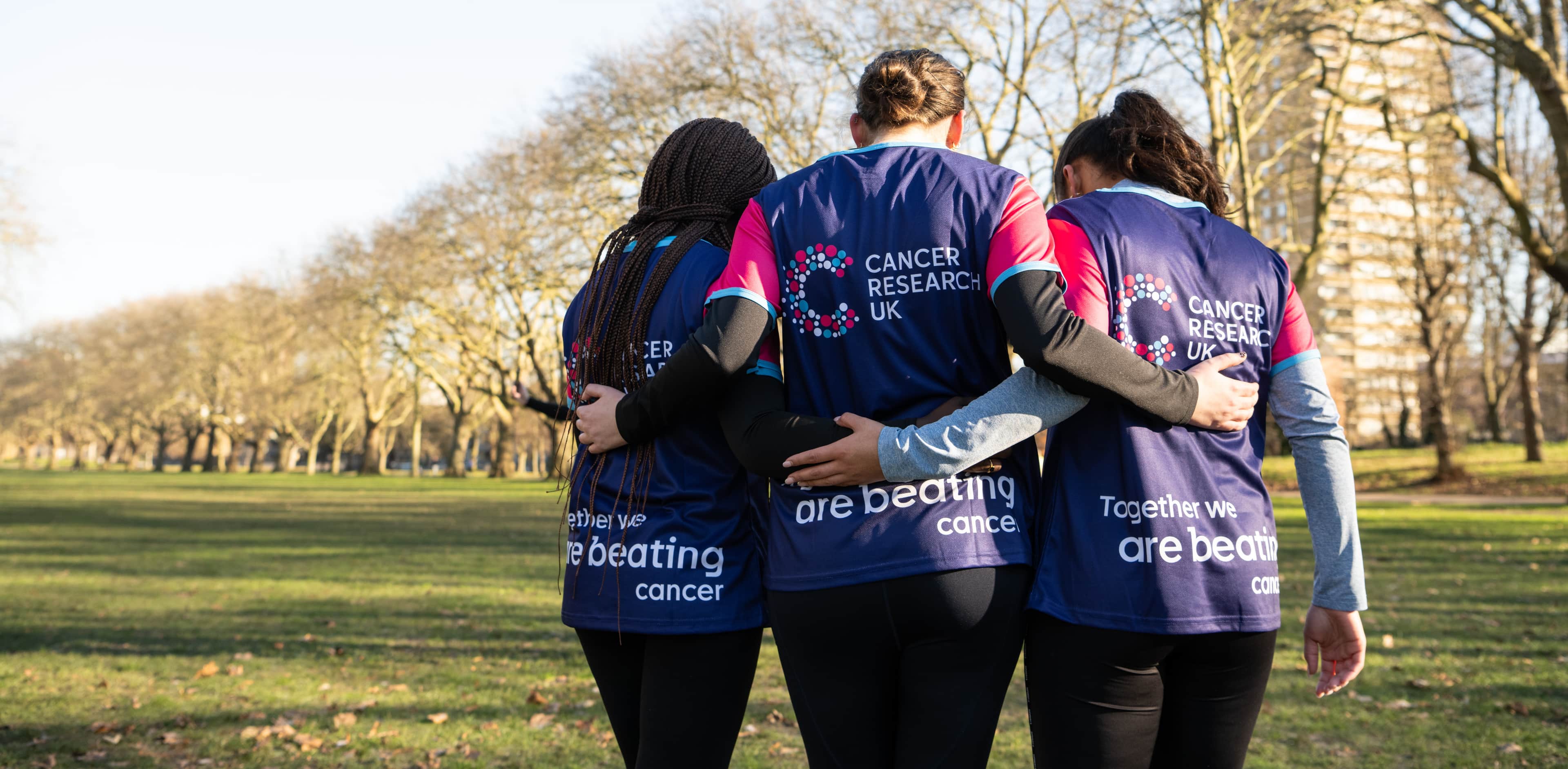 Group of supporters hugging.