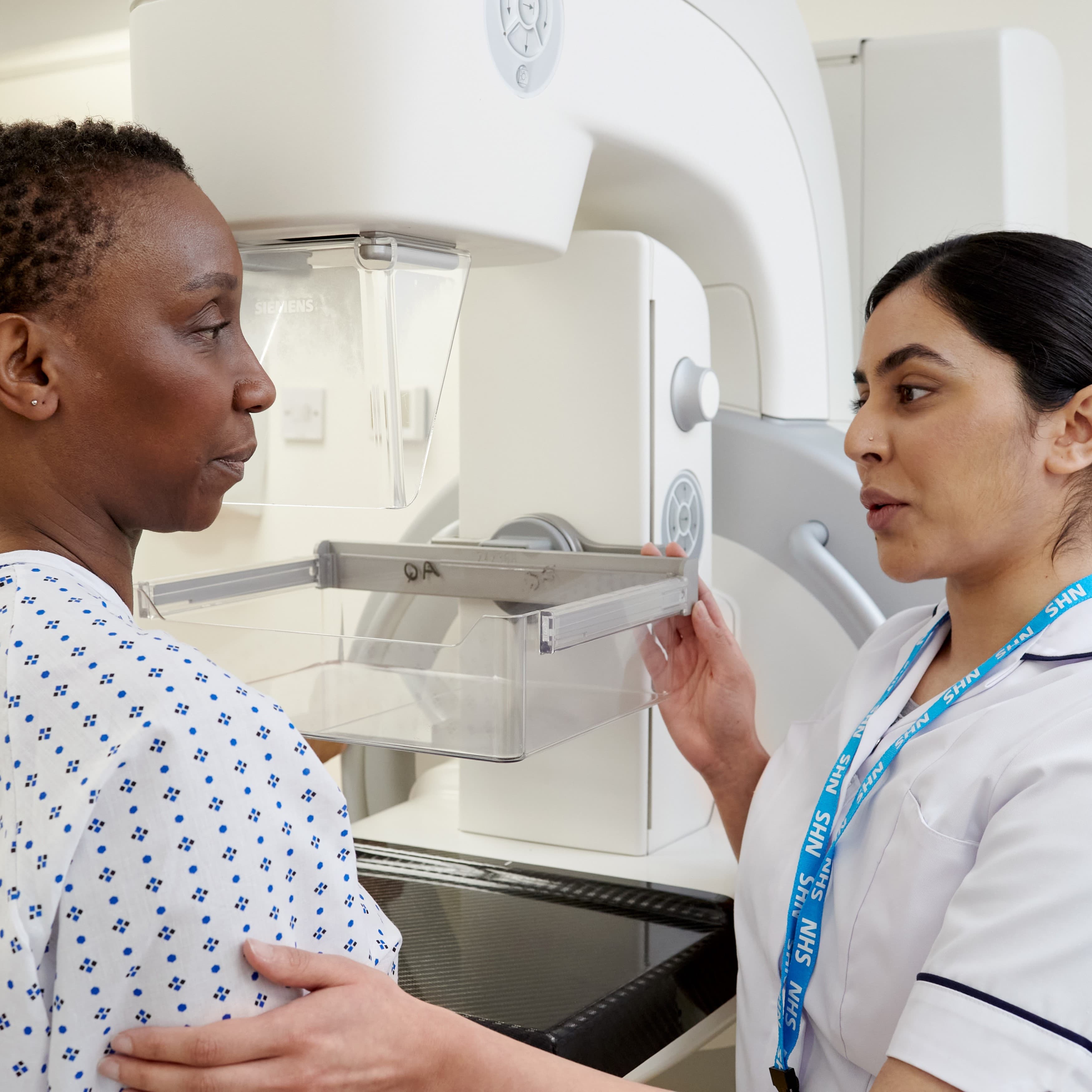 A patient and a healthcare professional in a medical setting.