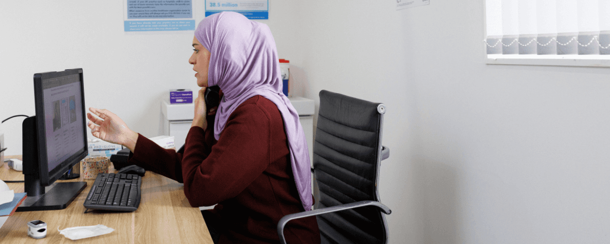Doctor looking for information on the computer screen.