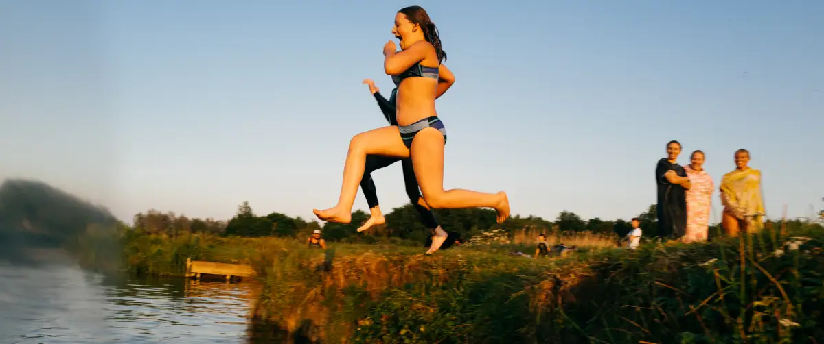 Shots of friends swimming in the wild greens.