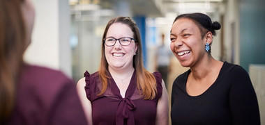 Photo of two women laughing