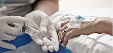 A chemotherapy line going into a patient's arm