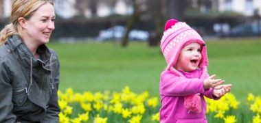 A child and woman playing outside