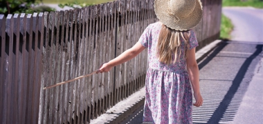 A young girl playing outside