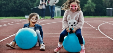 Children on space hoppers