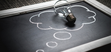 A lightbulb on a blackboard