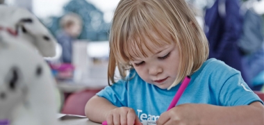 A young girl colouring