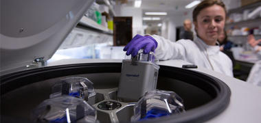 A female researcher working with lab equipment