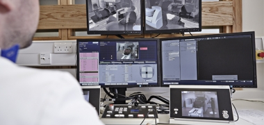 A doctor looking at a patient undergoing radiotherapy