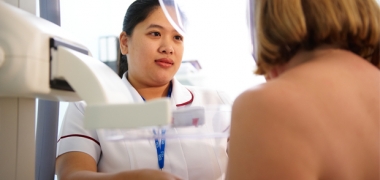 A woman having a mammogram