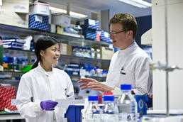 Two Cancer Research UK scientists talking