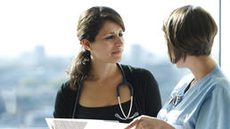 Nurse and doctor talking