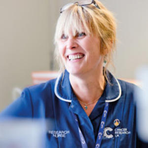 A Cancer Research UK nurse smiling