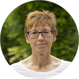 Sue, one of our pledgers, sitting outside. Thanks to pledges like Sue's, Cancer Research UK can invest in cutting-edge science, making a real different to future generations. 