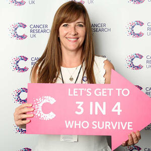 Image of Laura Ashurst holding a sign