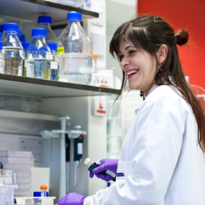 A scientist performing an experiment in the lab