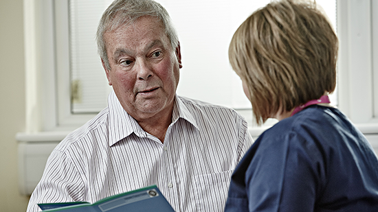 Image of doctor speaking to patient